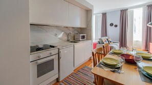 Nicely equipped kitchenette with a stove, microwave, oven and mini fridge + all the main cooking utensils needed for your homecooked meals! #kitchenette
