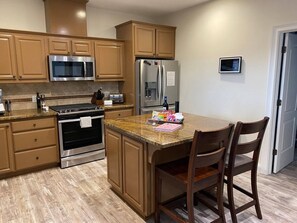 Fully equipped kitchen. Fridge, 5-burner stove, oven, microwave, dishwasher, Insta-Pot, Crockpot, blender, mixer, countertop grill/griddle, cooking utensils, pots/pans, BBQ tools, espresso maker, electric tea kettle, brew coffeemaker, knife set