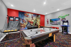Play A Game Of  Air Hockey, Pool or Fooseball In Our Air Conditioned Games Room