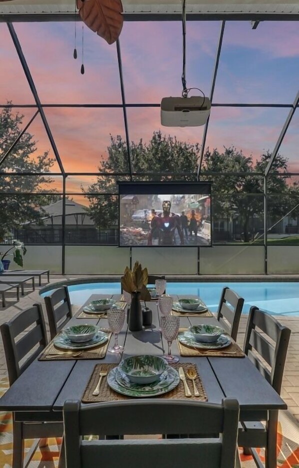 Watch a Movie Poolside On Our 120" Theatre Screen