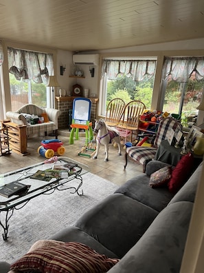 Very large play room with gas fireplace and large seating /eating area / sink