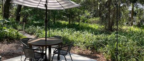 Shaded patio table for your early morning coffee.