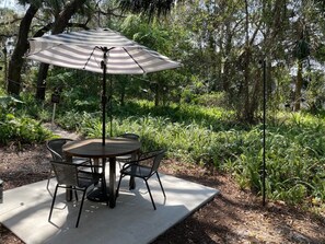 Shaded patio table for your early morning coffee.