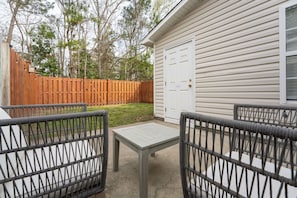 Relax on the patio and enjoy the private fenced in yard, perfect for dogs!