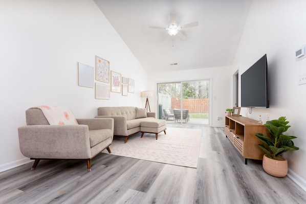 Relax in the living room & enjoy the smart TV with Hulu, Netflix & Disney Plus