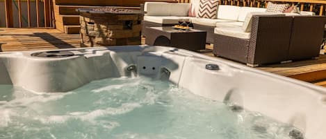 Unwind after a day full of adventure while soaking in the hot tub in the spacious backyard,