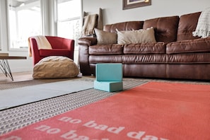 Next to this comfy sofa are yoga mats. Time for you to unroll to tranquility and inner balance.