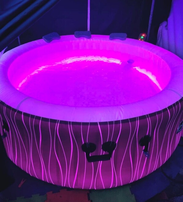Relax in the 4-6 person LED Hot Tub