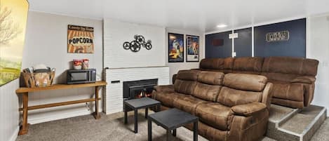 Theater Room with comfy seating, 85" TV and sound system!