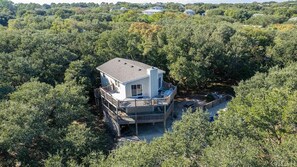 Nestled in a canopy of live oaks