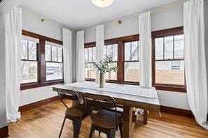 Dining room overlooking front yard and fenced side yard