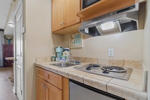 Kitchenette with microwave, sink and under counter refrigerator