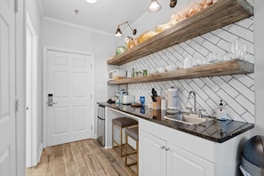 Kitchenette with granite counter tops.
