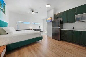Studio with king size bed and 2 futon couches
