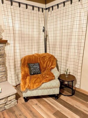 Reading nook in living room by fireplace