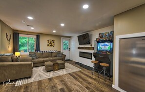 Enjoy watching a game or movie with the included cable subscription for the house with the ambiance of the electric fire place. Or test your skills with the 4 person retro arcade with 10,000+ games.