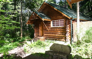 Log Cabin Exterior - Located off the back corner of Copper Creek Restaurant