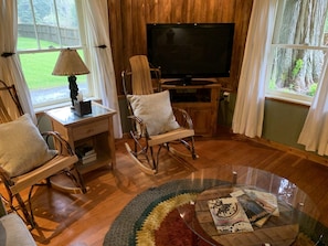 Big livingroom with two sofas and two rockers