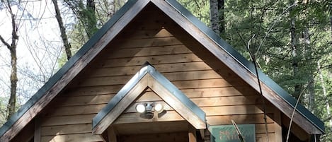 Sky Cabin with a front deck to view the beautiful surrounding property.