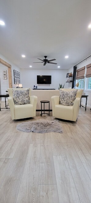 Additional Seating in Family Room.  Cozy up with a book in a comfy swivel chair