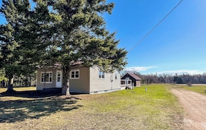 Front of house, showing bunkhouse behind and driveway