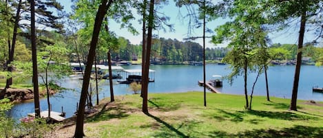 Gently sloping yard down to lake. Our dock is on the left. 