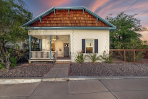 Front view of historic home (fenced property)