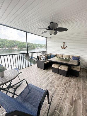 Spacious screened in porch with TV and beautiful lake view