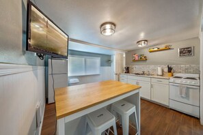 Kitchen with island/seating area with seating for two, and smart TV