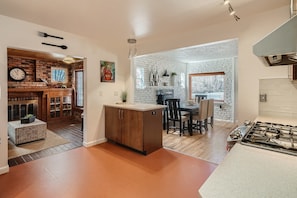 Fully Stocked Kitchen with Views of the Dining Area and 2nd Living Room