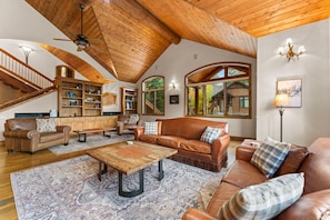 Living Room with balcony, gas fireplace, and flatscreen TV.