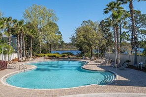Large resort style pool that overlooks the lake