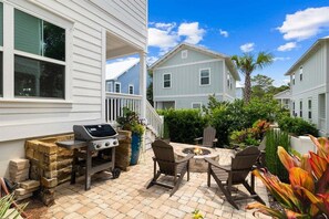Relax by the firepit or grill up your favorites in this cozy outdoor space.