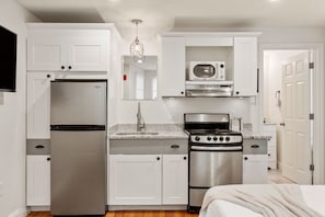 Kitchen with essentials. Glassware, utensils, baking sheets, cutting boards, and more. (1)