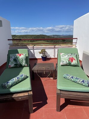 Private roof terrace with loungers and beautiful golf, mountain and sea views
