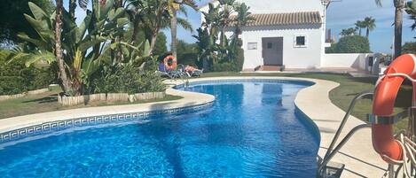 Beautiful pool area with gardens, loungers and changing/toilet facilities