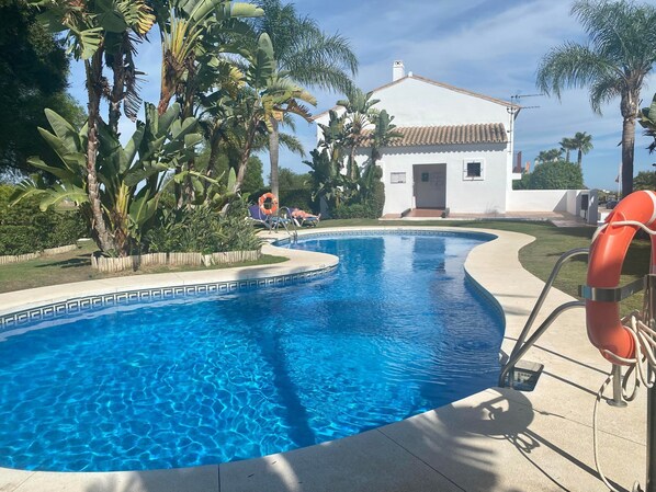 Beautiful pool area with gardens, loungers and changing/toilet facilities