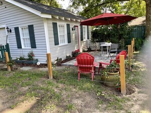 Outside patio with small dining table and seating