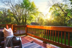 Enjoy getting some fresh air out on our back porch opening up to a large backyard.  Perfect for the pups or kiddos to run around in!  At night, get a nice view of the city skyline!