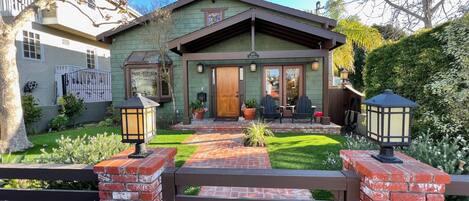 Front of home with nice gated front yard 
