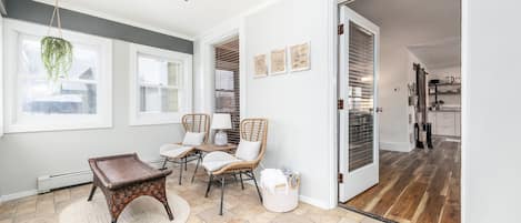 Enter through a comfortable enclosed porch