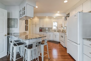 Recently renovated spacious kitchen with island on the main level.