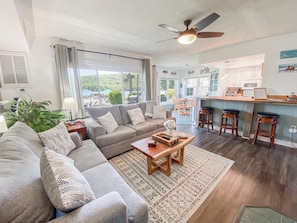 Enjoy lounging in the living room with lake & pool views! Comfy sleeper sofa