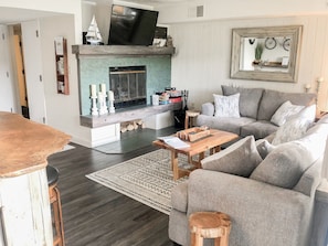 Cozy up by the wood burning fireplace while watching your favs on the SmartTV!