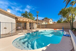 Fenced outdoor swimming pool