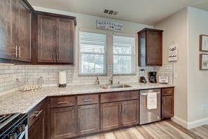 Kitchen with drip coffee maker.