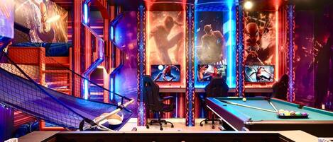 Ultimate Spider-Man-themed game room with bunk beds, arcade gaming, pool, and foosball.