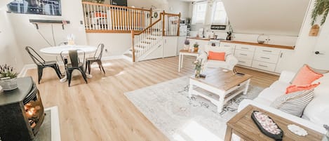 Open concept living room/kitchen/dining room space