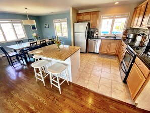 Open kitchen concept. Induction oven, 12 cup drip coffee pot, 4 bread toaster. 