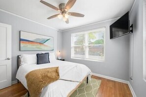 Both rooms have an end table with reading lamp.